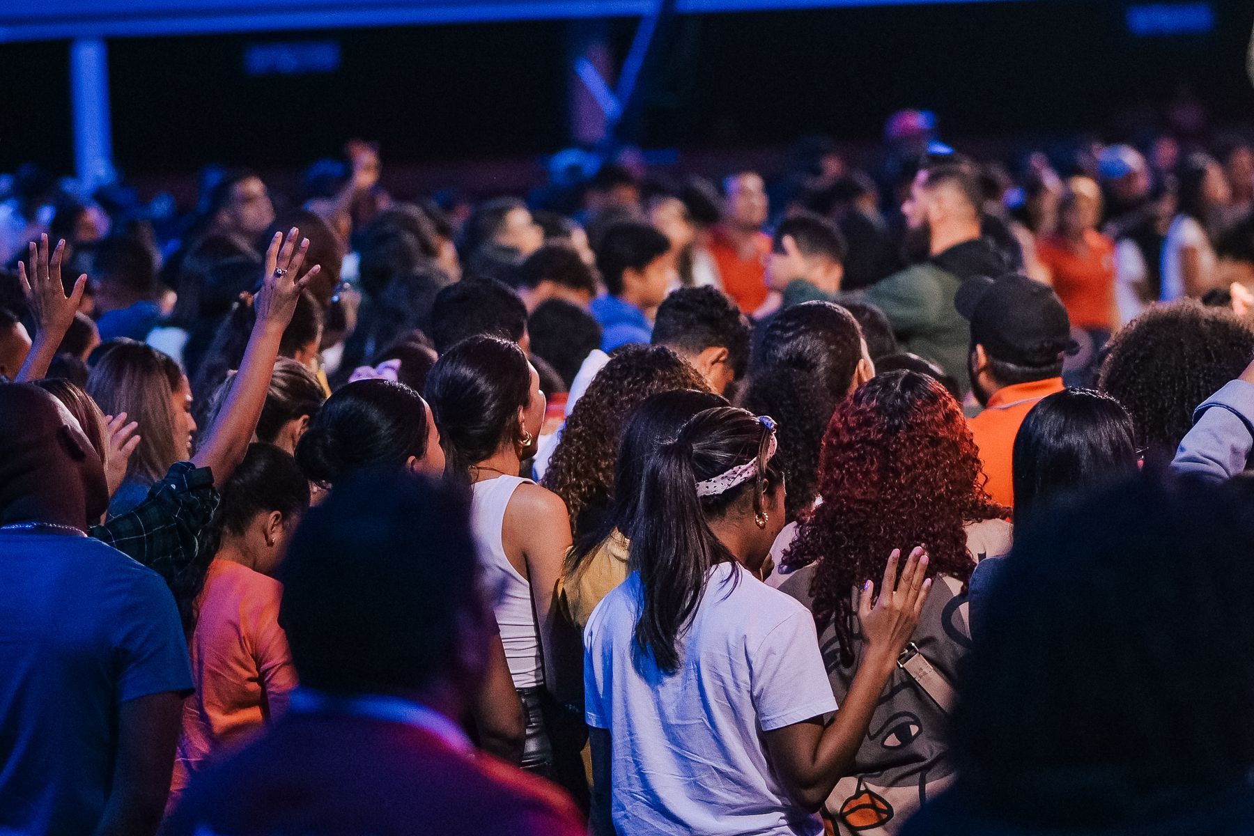 The church standing together in worship on a Sunday morning