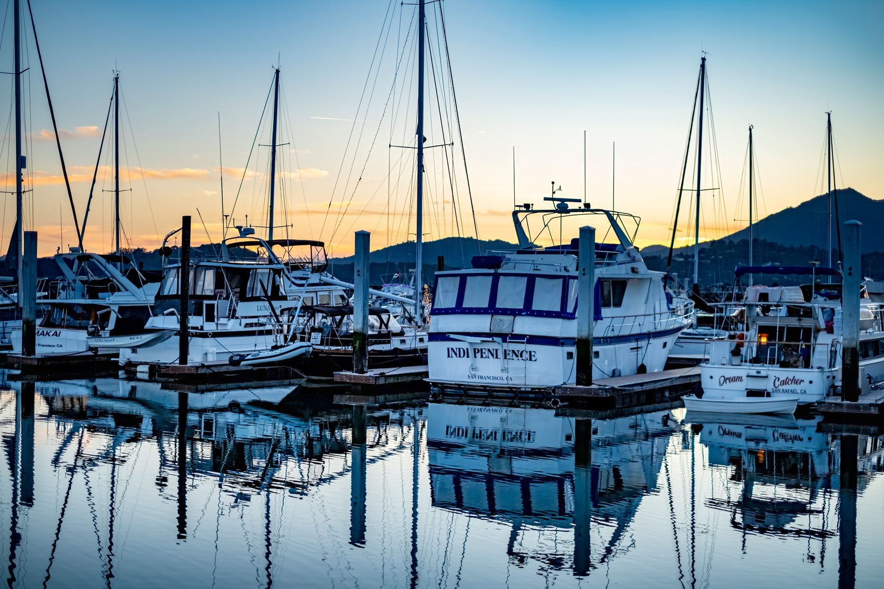 Boats resting in the harbour at dusk